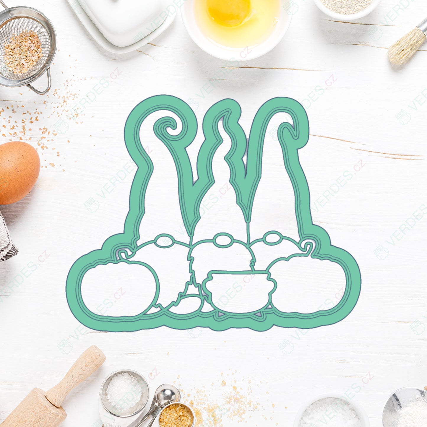 Three dwarfs with a pumpkin cookie cutter
